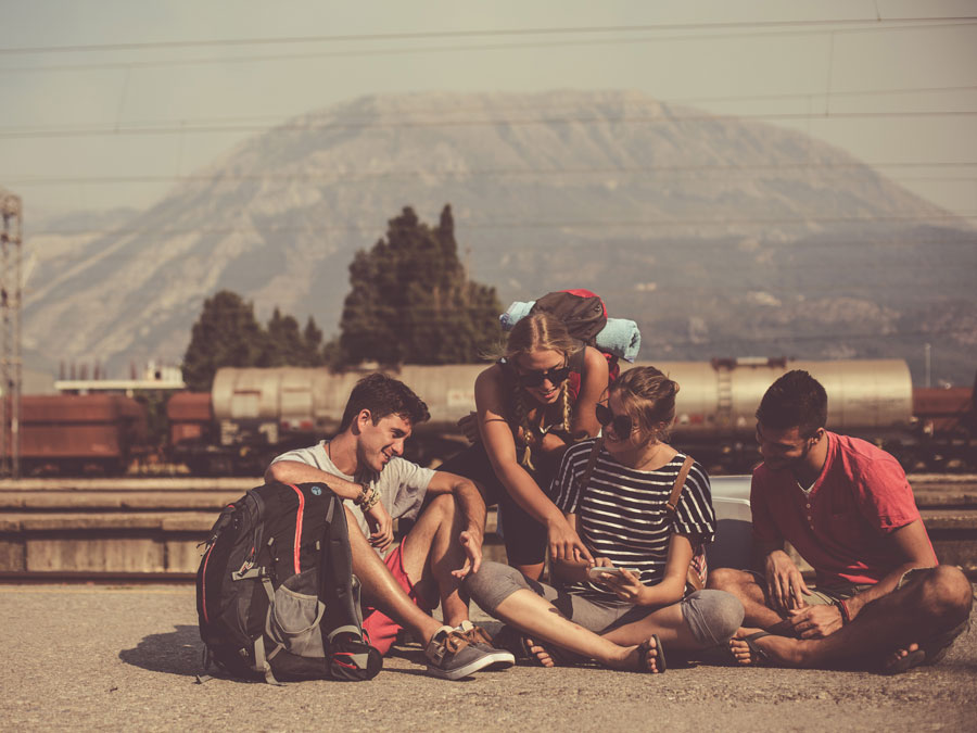 Student travellers waiting at the train station