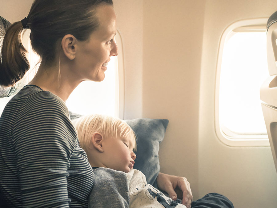 Baby sleeping on a flight